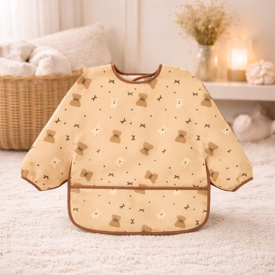 Bavoir bébé manche longue imperméable motif soleils verts, look joyeux et moderne